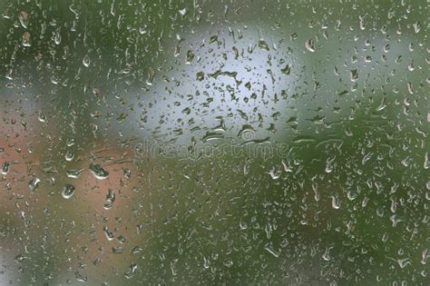 Raindrops On Window Glass During The Rain Natural Background Stock