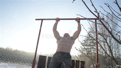 Pull Ups With A Naked Torso Outdoors In Winter Stock Video Video Of