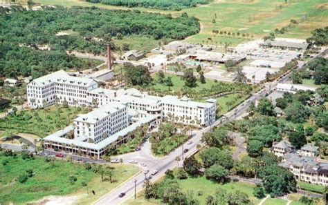 An Aerial View Of A Large Building Surrounded By Trees