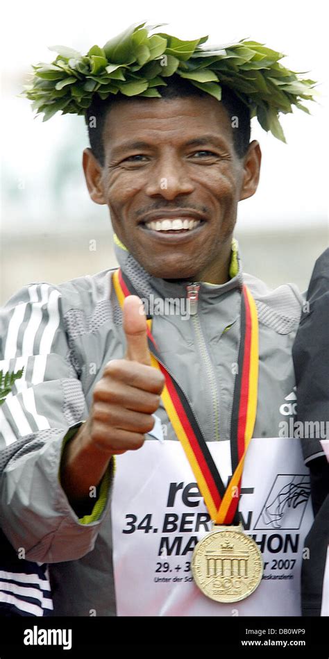 Ethiopian Haile Gebrselassie Is Pictured With Medal And Wreath After Winning The 34th Berlin