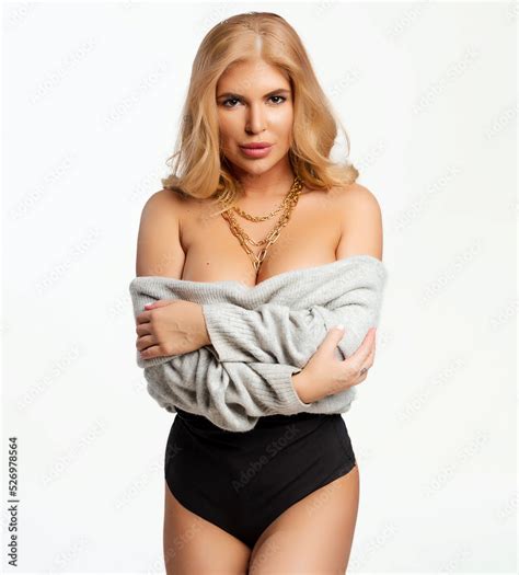 Gorgeous Blonde Woman Is Almost Naked In Knitted Sweater Stands With Her Naked Legs Sexy Female