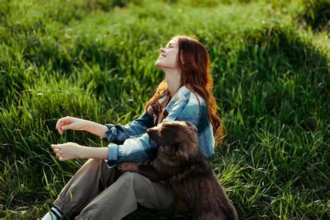 Premium Photo Side View Of Woman Sitting On Grass