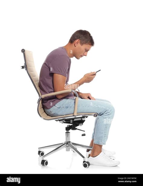 Man With Poor Posture Using Smartphone While Sitting In Armchair