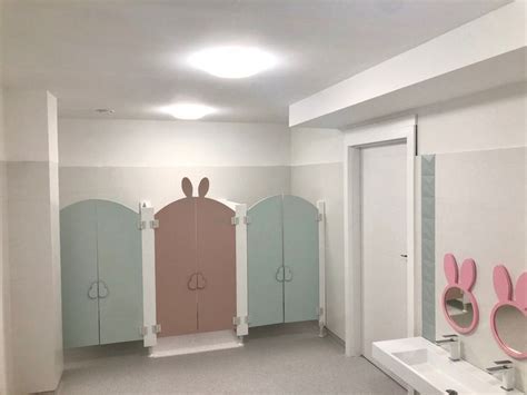 The Bathroom Is Decorated In Pastel Colors And Features Bunny Ears On