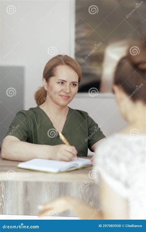 Smiling Female Medical Massage Therapist In Massage Cabinet Stock Photo