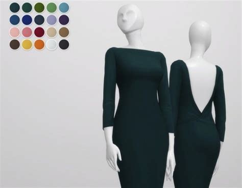 Two Mannequins Dressed In Dark Green Dresses With Different Colors On