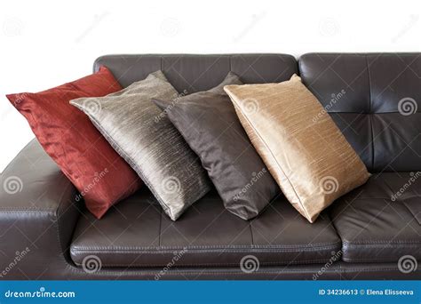 Cushions on leather sofa stock image. Image of cushions - 34236613