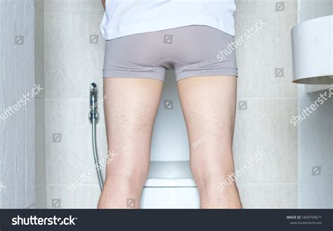 Man Peeing Toilet Bowl Restroom Back Stock Photo 1858799671 Shutterstock