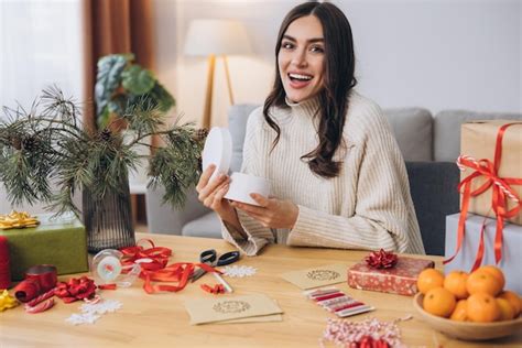 Premium Photo Woman Wrapping Christmas Presents Gifts