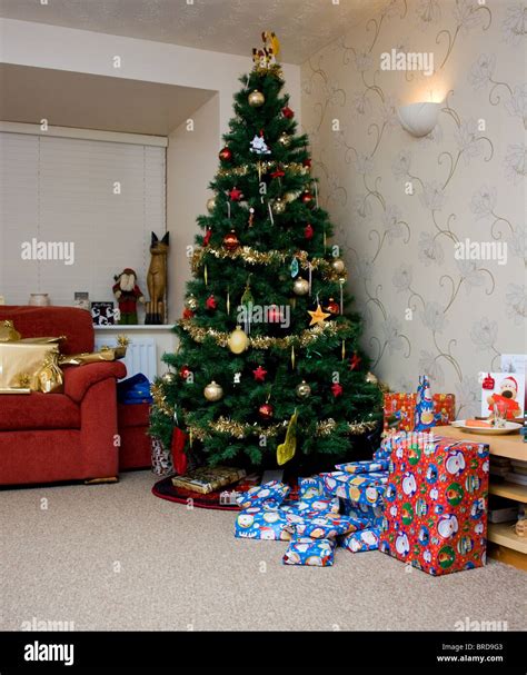 Traditional Christmas Tree Surrounded By Presents Stock Photo Alamy