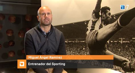 We meet Miguel Ángel Ramírez outside the red and white bench Miguel