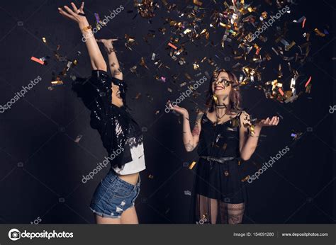 Young women with confetti — Stock Photo © NatashaFedorova #154091280