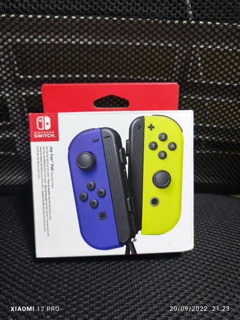 Nintendo switch joycon neon blue and yellow, Video Gaming, Gaming ...