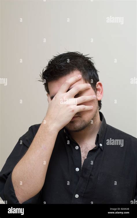 Man Hiding Face Stock Photo Alamy