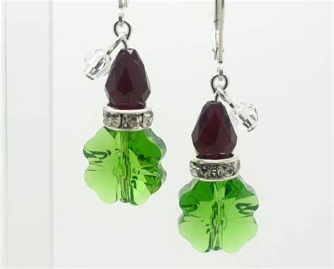 A Classic These Iconic Grinch Earrings With Dangly Santa Hats Are Made