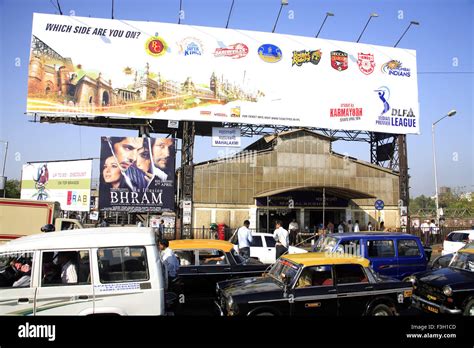 Mahalakshmi railway station & traffic on the road ; Bombay now Mumbai ...