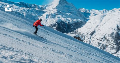 A skier going down a slope photo – Free Matterhorn Image on Unsplash