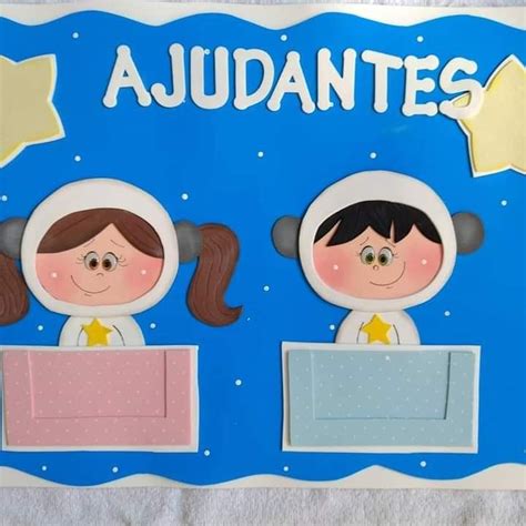 Two Paper Dolls Sitting On Top Of A Blue Board With The Words Audantes