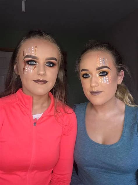 Two Women With Makeup On Their Faces Posing For The Camera