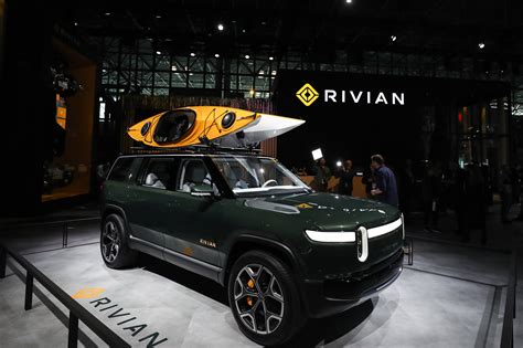 Amazon raises stake in e-trucking firm Rivian