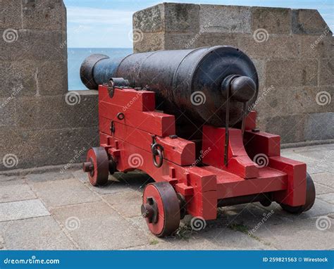 Canon in the castle walls stock image. Image of equipment - 259821563