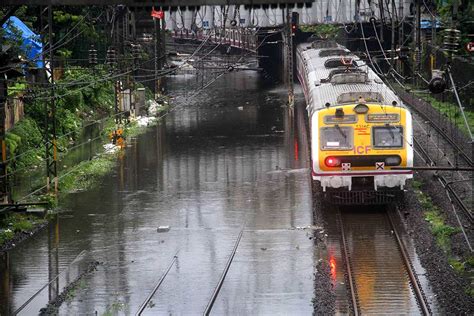 Heavy Rain Lashes Mumbai Local Trains Road Traffic Hit Due To Water