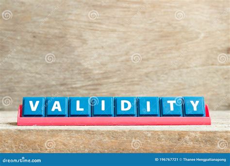 Tile Letter On Rack In Word Validity On Wood Background Stock Image