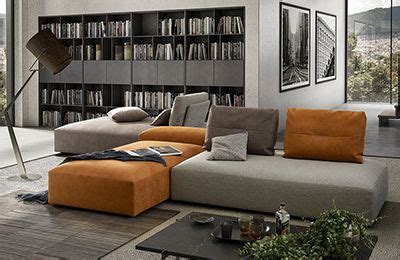 A Living Room Filled With Furniture And Bookshelves Next To A Large