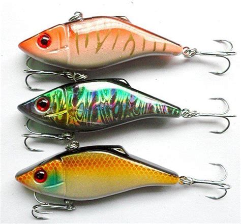 three different types of fishing lures on a white surface