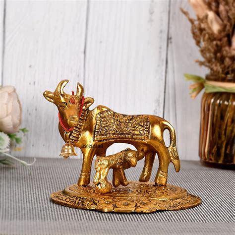 Buy Kamdhenu Cow And Calf Metal Statues Idols And Showpiece