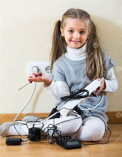 Little Girl Playing With Sockets At Home Stock Image Image Of Charger