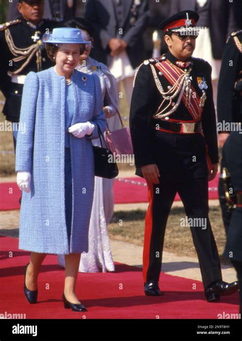 Britain S Queen Elizabeth II Walks With Nepal S King Birendra To Her