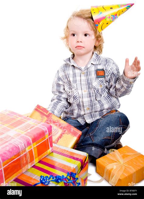 three year old boy open birthday gifts Stock Photo - Alamy