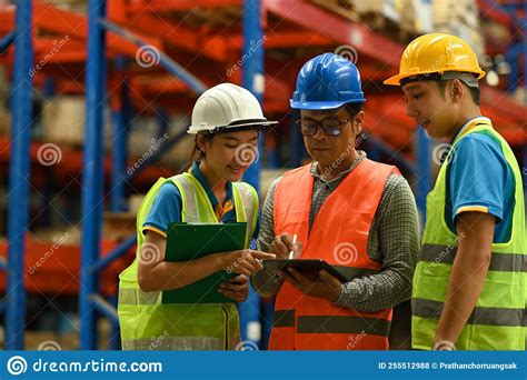 Senior Male Manager And Warehouse Workers Are Inspecting Stock Tick And