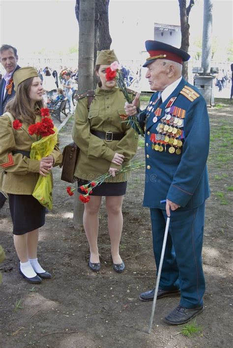 War Veteran Man Portrait He Receives Flowers From Young Women