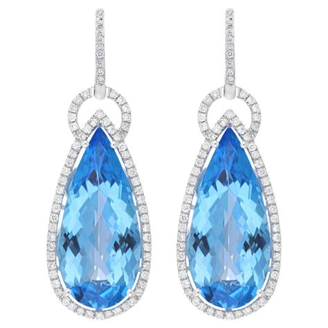 Swiss Blue Topaz And Diamond Studded 14 Karat White Gold Earring For