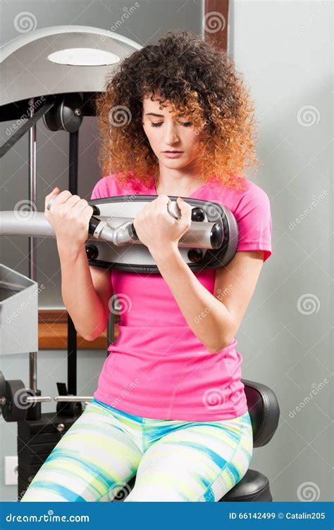 Woman Doing Biceps Workout With Exercising Machine Stock Image Image