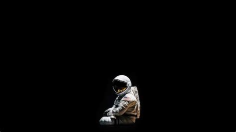 Premium Photo | Astronaut in the dark wallpaper space wallpaper