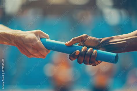 Passing The Relay Baton Close Up Of Two Hands Passing The Baton In A