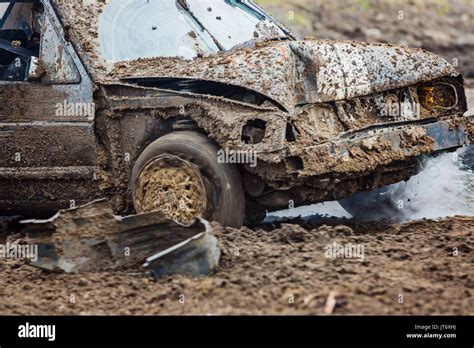 Wreck scrap cars dirt race. Dirty old car racing with broken radiator - coolant leak Stock Photo ...