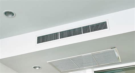 Ceiling Mounted Cassette Type Air Conditioner And Modern Lamp Light On White Ceiling Duct Air