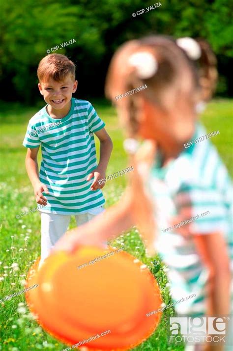 Children Playing Frisbee Stock Photo Picture And Low Budget Royalty