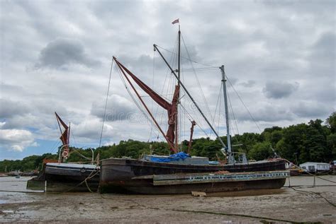 Boats Stranded By Low Tide On The River Orwell At Pin Mill Stock Photo