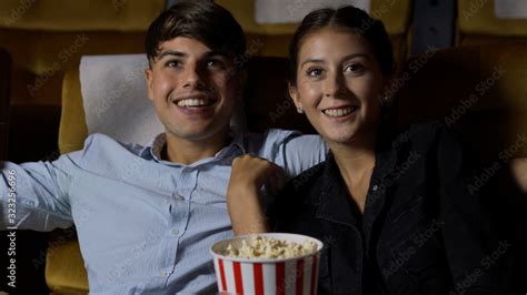 People audience watching movie in the movie theater cinema. Group recreation activity and ...