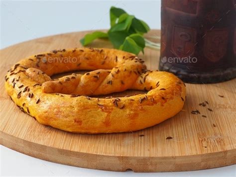 Traditional Pretzel With Cumin And A Leather Beer Mug In Medieval Style