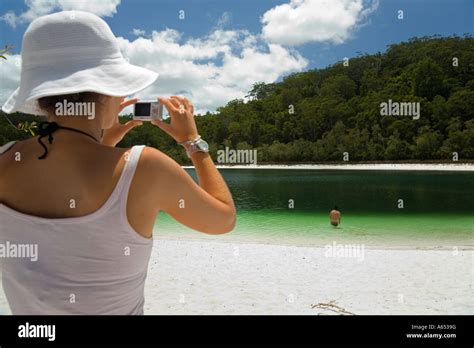 A Tourist Takes A Photo Of The Green Waters Of Basin Lake One Of The