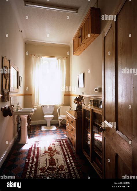 Interior Of Traditional English Bathroom Toilet Wc With Pine Furniture