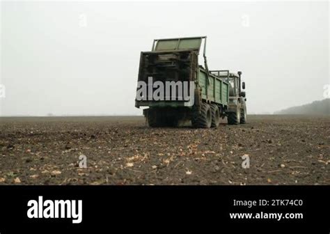 Fertilizing Fields With Compost Fertilization Of Earth With Organic