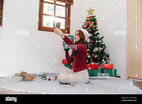 Holiday Selfie At Christmas Tree Happy Young Girl Taking Selfie On