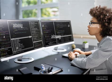 Software Programmer Or Coder Woman Using Office Computer Stock Photo